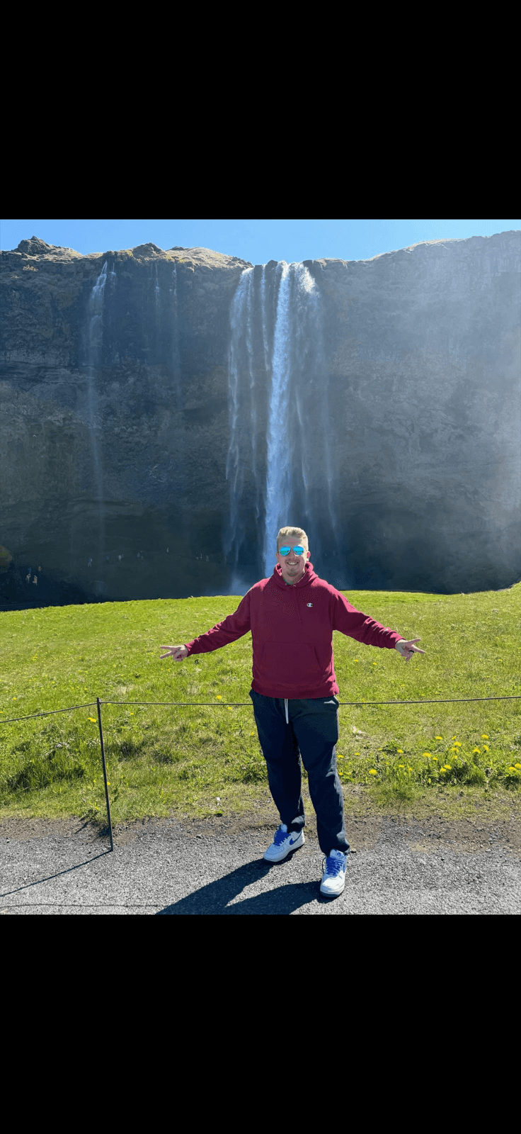 Cooper Parsons at a waterfall on one of his travels